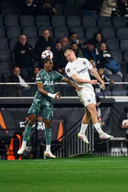 FRANKFURT, GERMANY - 17 APRIL, 2025: Mathys Tel, Rasmus Kristensen - Eintracht Frankfurt Tottenham Hotspur F.C. Deutsche Bank Park 'ta..
