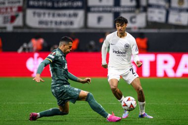 FRANKFURT, GERMANY - 17 APRIL, 2025: Cristian Romero, Can Uzun - Eintracht Frankfurt Tottenham Hotspur F.C. Deutsche Bank Park 'ta..