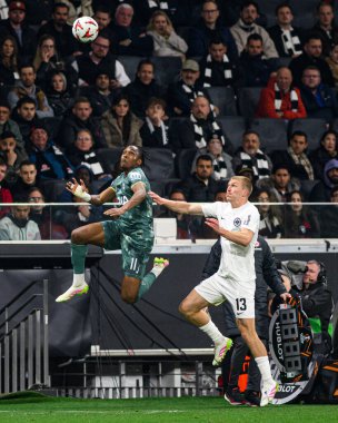 FRANKFURT, GERMANY - 17 APRIL, 2025: Mathys Tel, Rasmus Kristensen - Eintracht Frankfurt Tottenham Hotspur F.C. Deutsche Bank Park 'ta..
