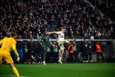 FRANKFURT, GERMANY - 17 APRIL, 2025: Rasmus Kristensen, Destiny Udogie - Eintracht Frankfurt Tottenham Hotspur F.C. Deutsche Bank Park 'ta..