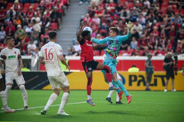 LEVERKUSEN, GERMANY - 26 APRIL, 2025: Nathan Tella, Finn Dahmen - Bayer 04 Leverkusen-FC Augsburg maçı Bayena 'da.