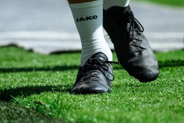 COLOGNE, GERMANY - 20 Nisan 2025: Nike Air Zoom Mercurial Vapor XVI Academy FG / MG Shadow Schwarz F0 - Rhein Energie Stadion.