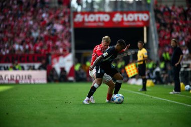 MAINZ, GERMANY - 17 Mayıs 2025: Jonathan Burkardt, Arthur - Bundesliga maçı 1.FSV Mainz 05 - Bayer 04 Leverkusen maçı Mewa Arena 'da.