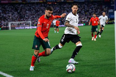 MUNICH, GERMANY - 4 Haziran 2025: Bruno Fernandes, Robin Koch - UEFA Uluslar Ligi 2025 Almanya - Allianz Arena 'da Portekiz' e karşı. 