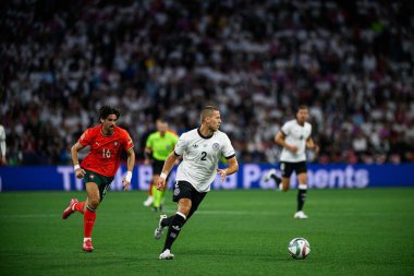 MUNICH, GERMANY - 4 Haziran 2025: Francisco Trincao, Waldemar Anton - UEFA Milletler Ligi 2025 Almanya - Allianz Arena 'da Portekiz' e karşı. 