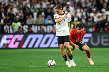 MUNİH, GERMANY - 4 Haziran 2025: Florian Wirtz, Joao Neves - UEFA Uluslar Ligi 2025 Almanya - Allianz Arena 'da Portekiz' e karşı. 