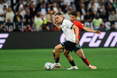 MUNİH, GERMANY - 4 Haziran 2025: Florian Wirtz, Joao Neves - UEFA Uluslar Ligi 2025 Almanya - Allianz Arena 'da Portekiz' e karşı. 