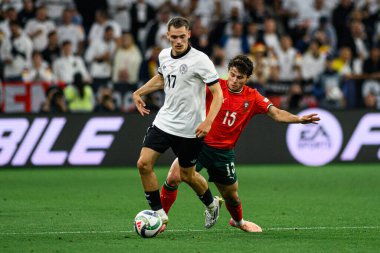 MUNİH, GERMANY - 4 Haziran 2025: Florian Wirtz, Joao Neves - UEFA Uluslar Ligi 2025 Almanya - Allianz Arena 'da Portekiz' e karşı. 