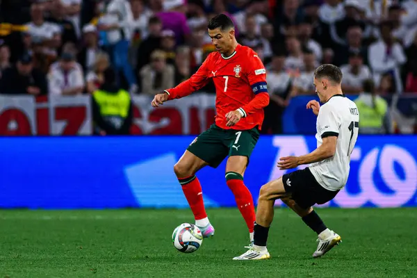 MUNİH, GERMANY - 4 Haziran 2025: Cristiano Ronaldo, Florian Wirtz - UEFA Uluslar Ligi 2025 Almanya - Allianz Arena 'da Portekiz' e karşı. 