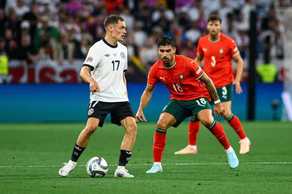 MUNİH, GERMANY - 4 Haziran 2025: Florian Wirtz, Ruben Neves - UEFA Uluslar Ligi 2025 Almanya - Allianz Arena 'da Portekiz' e karşı. 