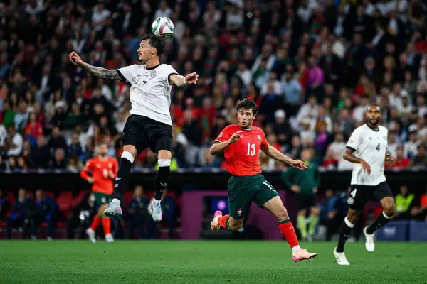 MUNİH, GERMANY - 4 Haziran 2025: Robin Koch, Joao Neves - UEFA Uluslar Ligi 2025 Almanya - Allianz Arena 'da Portekiz' e karşı. 
