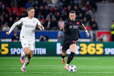 LEVERKUSEN, GERMANY - 1 OCTOBER, 2025: Joey Veerman, Aleix Garcia - The UEFA Champions League football match between Bayer 04 Leverkusen vs PSV Eindhoven at BayArena.