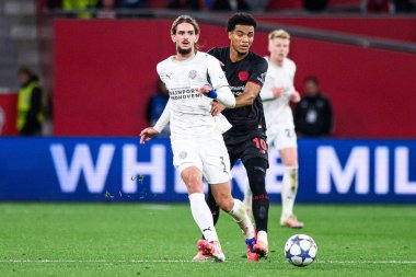 LEVERKUSEN, GERMANY - 1 OCTOBER, 2025: Yarek Gasiorowski, Malik Tillman - The UEFA Champions League football match between Bayer 04 Leverkusen vs PSV Eindhoven at BayArena.