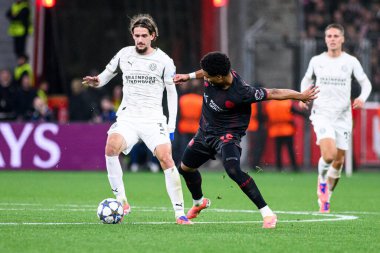 LEVERKUSEN, GERMANY - 1 OCTOBER, 2025: Yarek Gasiorowski, Malik Tillman - The UEFA Champions League football match between Bayer 04 Leverkusen vs PSV Eindhoven at BayArena.
