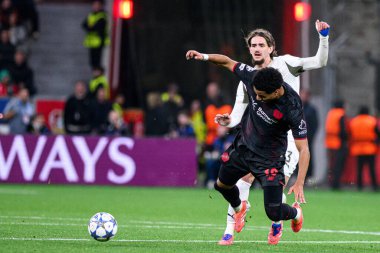 LEVERKUSEN, GERMANY - 1 OCTOBER, 2025: Yarek Gasiorowski, Malik Tillman - The UEFA Champions League football match between Bayer 04 Leverkusen vs PSV Eindhoven at BayArena.