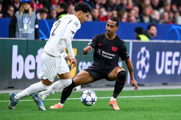 LEVERKUSEN, GERMANY - 1 OCTOBER, 2025: Anass Salah-Eddine, Arthur - The UEFA Champions League football match between Bayer 04 Leverkusen vs PSV Eindhoven at BayArena.