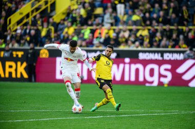 DORTMUND, GERMANY - 4 Ekim 2025: Romulo Cardoso da Cruz, Yan Couto - 1.Bundesliga maçı Borussia Dortmund vs RB Leipzig at Signal Iduna Park.
