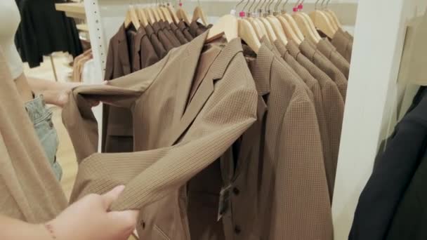 Young Woman Chooses Clothes Black Friday Sale Shopping Big Discounts — Stock Video