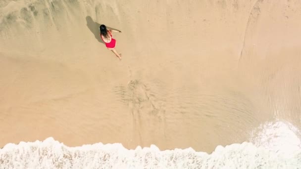 Aerial View Young Woman Red Swimsuit Drawing Big Heart Sand — Stock Video