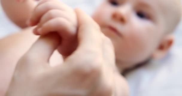 Close Mothers Hands Holding Small Hand Her Newborn Daughter Caring — Stock Video