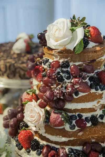Wedding cake with fruit and rose. High quality photo