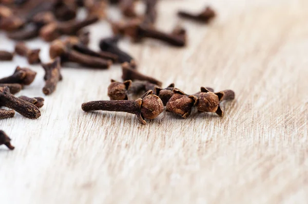 Cloves Laying Rustic Table Close Stock Photo