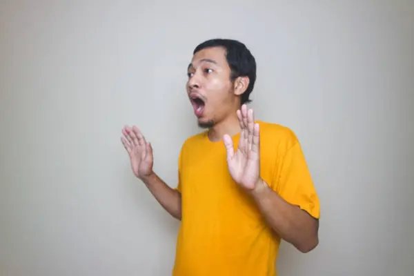 stock image Portrait of young Asian man posing on white background