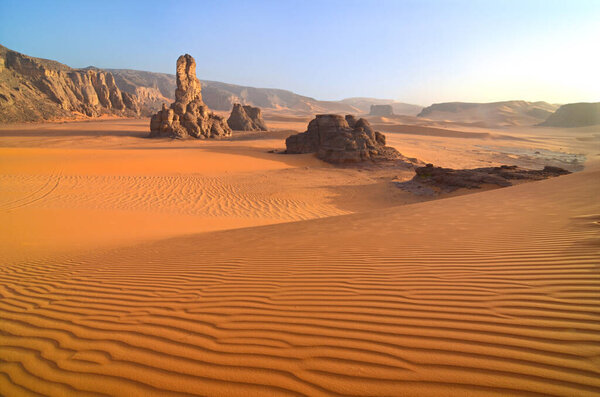A natural arch formed in sandstone in the Sahara Desert in Algeria