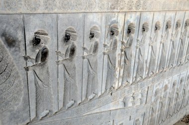 Bas reliefs that depict delegations from across the Persian empire bringing tribute to the Achaemenid kings in Persepolis, Iran clipart