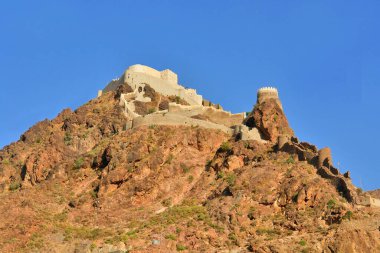    Al-Qahira Castle located on the northern slope of Mount Sabr,   in the ancient city of Taiz, Yemen.                             clipart