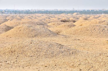 The Dilmun Burial Mounds a UNESCO World Heritage Site comprising necropolis areas on the main island of Bahrain  clipart