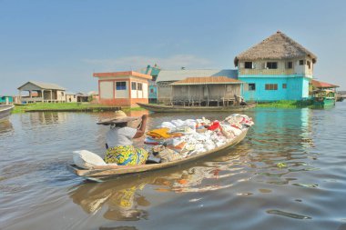      Boat dock and boats  on the  Lake Nokou near Cotonou, Benin                           clipart