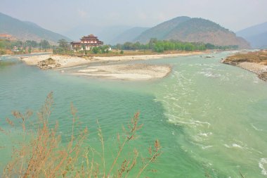       The Punakha Dzong administrative centre of Punakha District in Punakha, Bhutan                          clipart