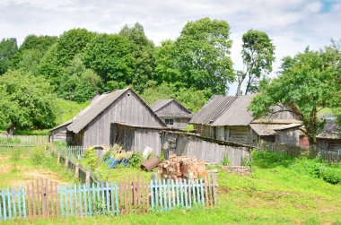   View of wooden houses in the town of Rakw in Belarus, formerly Polish territory                              clipart