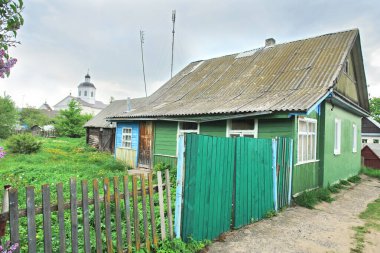   View of wooden houses in the town of Rakw in Belarus, formerly Polish territory                              clipart