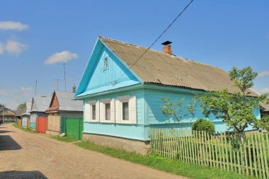   View of wooden houses in the town of Rakw in Belarus, formerly Polish territory                              clipart