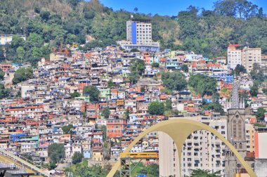 View of a slum in Rio de Janeiro called Favela with the famous Sambodroe n in the foreground , Brazil clipart