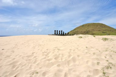 Anakena  coral sand beach in Rapa Nui National Park (Easter Island) wirh  Ahu-Ature single moai and Ahu Nao-Nao with seven moai seven clipart