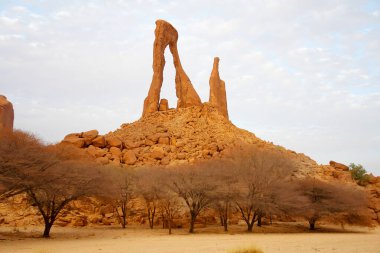 Arch of Bachikele in the shape of lyre, desert of Ennedi, Chad clipart