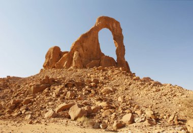 Arch of Bachikele in the shape of lyre, desert of Ennedi, Chad clipart