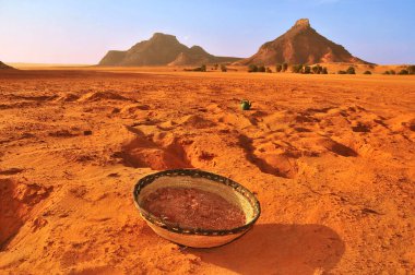 Red Salt (sodium carbonate)  collected from Salines de Teguedei by the Lake Teguedei on Sahara Desert in northen Chad. clipart