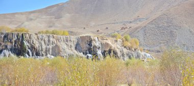 Natural travertine dam on Lake Band-e Haibat in Afghanistan's Band-e Amir National Park clipart