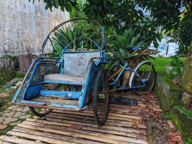 Becak is a three-wheeled mode of transportation that moves by pedaling like a bicycle.