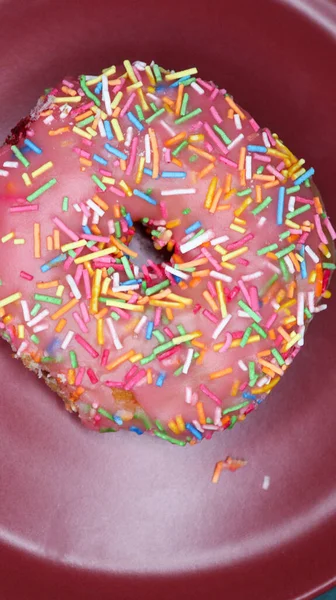 Pink Sauce Covered Donut Colorful Sprinkles Top Placed Red Plate — Stock Photo, Image