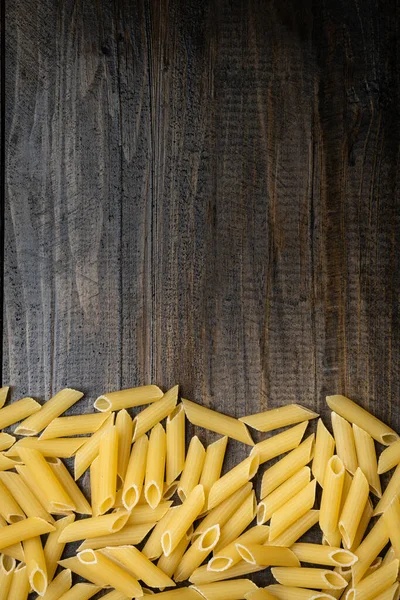 Italian Pasta Raw Penne Wooden Background — Stock Photo, Image
