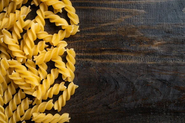 Italian Pasta Raw Fusilli Wooden Background — Stock Photo, Image