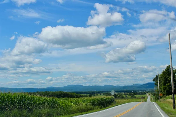 stock image beautiful landscape with a road and a blue sky