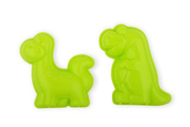 Yeşil ahtapot ve pembe arka planda kabuklu deniz hayvanı oyuncakları. 