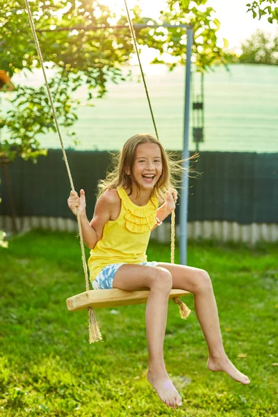 Happy Barefoot Laughing Child Girl Swinging Swing Sunset Summer Day — Stock Photo, Image