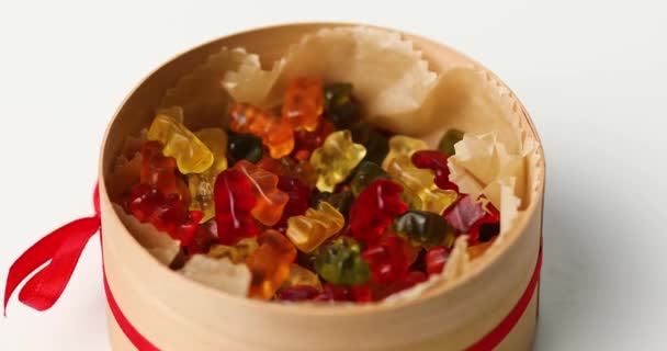Rotation Tasty Jelly Bears Candy Present Box White Background Flat — стоковое видео